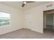 Bedroom with ceiling fan and large window at 17048 Oval Rum Dr, Wimauma, FL 33598