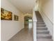 Bright and airy entryway with staircase at 17048 Oval Rum Dr, Wimauma, FL 33598