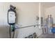 Garage with electric vehicle charger and extra storage space at 17048 Oval Rum Dr, Wimauma, FL 33598