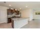 Modern kitchen with granite countertops and stainless steel appliances at 17048 Oval Rum Dr, Wimauma, FL 33598