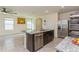 Kitchen with stainless steel appliances and granite island at 17048 Oval Rum Dr, Wimauma, FL 33598