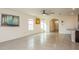 Spacious living area with tile floors and access to the kitchen at 17048 Oval Rum Dr, Wimauma, FL 33598