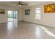 Spacious living room with tile floors and ceiling fan at 17048 Oval Rum Dr, Wimauma, FL 33598