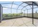 Spacious screened patio with a view of the backyard at 17048 Oval Rum Dr, Wimauma, FL 33598