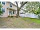 Large backyard with a tree and a tire swing at 208 Elm View Ct, Brandon, FL 33511