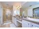 Double vanity bathroom with granite countertop and large shower at 208 Elm View Ct, Brandon, FL 33511