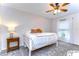 Bright bedroom featuring a queen bed and ample natural light at 208 Elm View Ct, Brandon, FL 33511