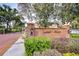 Lumsden Reserve community entrance with brick wall, landscaping, and gated entry at 208 Elm View Ct, Brandon, FL 33511