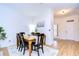 Charming dining area with rustic wooden table and black chairs at 208 Elm View Ct, Brandon, FL 33511