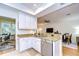 Bright kitchen featuring granite countertops and a view into the dining area at 208 Elm View Ct, Brandon, FL 33511