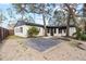 Spacious backyard with a large deck and landscaping at 210 W Floriland Ave, Tampa, FL 33612