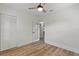 Well-lit bedroom with light walls, wood floors and a closet at 210 W Floriland Ave, Tampa, FL 33612