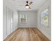 Spacious bedroom with light walls, wood floors, and ceiling fan at 210 W Floriland Ave, Tampa, FL 33612