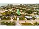 Aerial view of a charming light teal home with a spacious yard, located near the beach at 214 85Th St, Holmes Beach, FL 34217