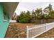 Backyard with white picket fence and small lawn area at 214 85Th St, Holmes Beach, FL 34217