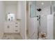 Bathroom with white vanity and marble shower at 214 85Th St, Holmes Beach, FL 34217