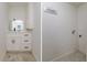 Bright laundry room with white cabinets and washer/dryer hookups at 214 85Th St, Holmes Beach, FL 34217