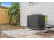 New AC unit in the backyard near a palm tree and fence at 2242 22Nd S Ave, St Petersburg, FL 33712