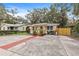 Cute cottage with a spacious front yard and wooden fence at 2242 22Nd S Ave, St Petersburg, FL 33712