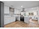 Stylish kitchen with white shaker cabinets and stainless steel appliances at 2242 22Nd S Ave, St Petersburg, FL 33712