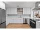 Updated kitchen featuring white cabinets, quartz counters, and stainless steel appliances at 2242 22Nd S Ave, St Petersburg, FL 33712