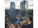 Aerial view of two modern high-rise buildings and surrounding cityscape at dusk at 235 1St S Ave # 3502, St Petersburg, FL 33701