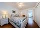 Bright bedroom with a floral comforter and hardwood floors at 2363 Israeli Dr # 25, Clearwater, FL 33763