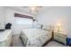 Bedroom with a floral comforter and nightstands at 2363 Israeli Dr # 25, Clearwater, FL 33763