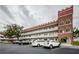 Exterior view of a two-story building with unique architectural details and parking at 2363 Israeli Dr # 25, Clearwater, FL 33763