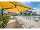 Lush poolside landscape with shaded seating at 2363 Israeli Dr # 25, Clearwater, FL 33763