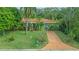 Single-story home with a terracotta roof and lush landscaping at 263 Overbrook E St, Largo, FL 33770