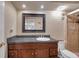 Bathroom with dark vanity and shower at 2700 Nebraska Ave # 3-201, Palm Harbor, FL 34684