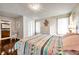 Bedroom with white dresser and patterned bedding at 2700 Nebraska Ave # 3-201, Palm Harbor, FL 34684