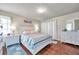 Bedroom with white dresser and patterned bedding at 2700 Nebraska Ave # 3-201, Palm Harbor, FL 34684