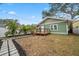 Landscaped backyard with stone pathway and home view at 2758 3Rd S Ave, St Petersburg, FL 33712