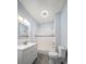 Updated bathroom with white vanity, tub, and tile flooring at 2758 3Rd S Ave, St Petersburg, FL 33712