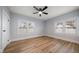 Large bedroom with wood-look flooring and multiple windows at 2758 3Rd S Ave, St Petersburg, FL 33712