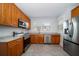 Modern kitchen with wood cabinets and stainless steel appliances at 2758 3Rd S Ave, St Petersburg, FL 33712