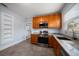 Kitchen with wood cabinets, granite counters, and stainless steel appliances at 2758 3Rd S Ave, St Petersburg, FL 33712