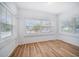 Bright sunroom with hardwood floors and windows at 2758 3Rd S Ave, St Petersburg, FL 33712