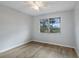 Well-lit bedroom featuring wood-look floors and a window at 314 Barlow Ave # 73, Sarasota, FL 34232