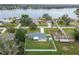 Aerial view of a single-Gathering home near a lake, showing backyard and surrounding houses at 3400 Lake Padgett Dr, Land O Lakes, FL 34639