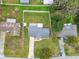 Aerial view of a single-Gathering home with a large backyard and driveway at 3400 Lake Padgett Dr, Land O Lakes, FL 34639