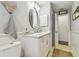 Bright bathroom with a white vanity and a view to another room at 3400 Lake Padgett Dr, Land O Lakes, FL 34639