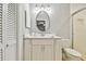 Updated bathroom with white vanity, oval mirror, and walk-in shower at 3400 Lake Padgett Dr, Land O Lakes, FL 34639