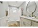 Charming bathroom, featuring a white vanity and a tub at 3400 Lake Padgett Dr, Land O Lakes, FL 34639