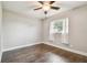 Bedroom with wood-look floors and ceiling fan at 3400 Lake Padgett Dr, Land O Lakes, FL 34639