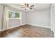 Bright bedroom with wood floors, ceiling fan and window at 3400 Lake Padgett Dr, Land O Lakes, FL 34639