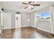 Bright bedroom with wood floors, window and ceiling fan at 3400 Lake Padgett Dr, Land O Lakes, FL 34639