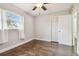 Bedroom with wood floors, ceiling fan and window at 3400 Lake Padgett Dr, Land O Lakes, FL 34639